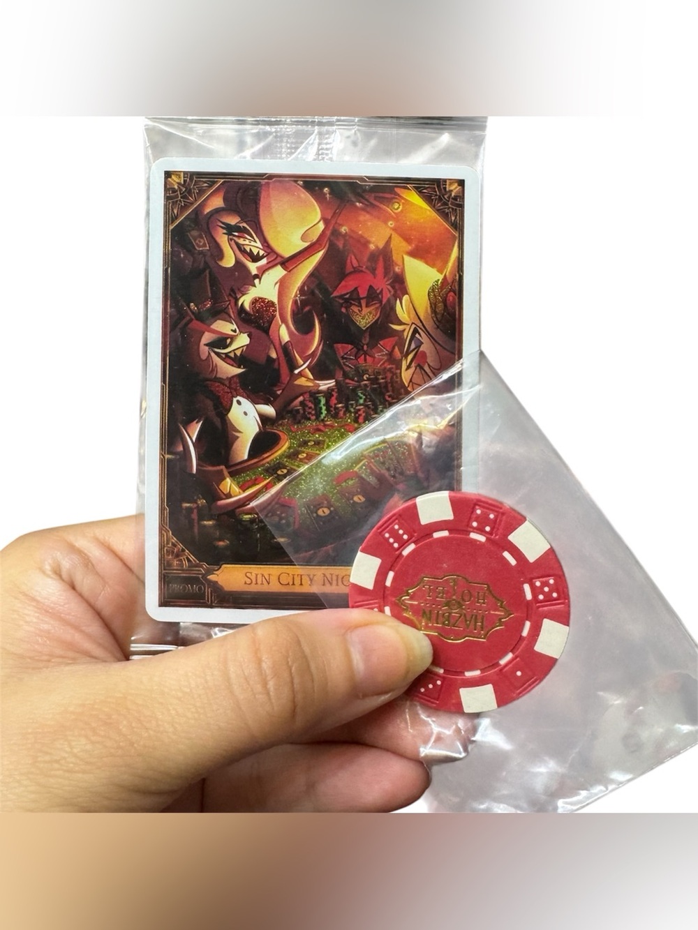 Hazbin Hotel Sin City Night LVLUP Exclusive Trading Card & Poker Chip